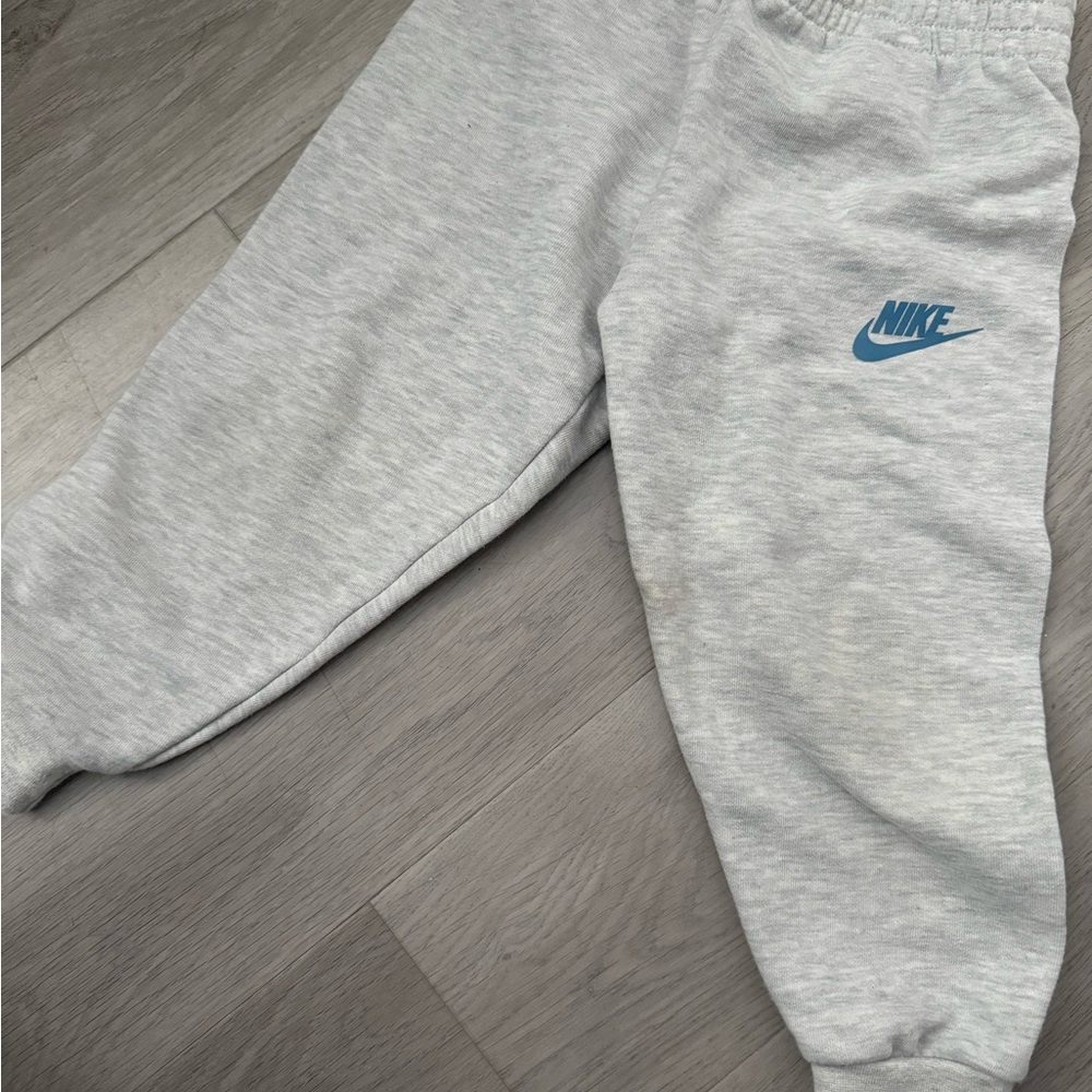 Nike Kids Light Gray Joggers with Blue Logo